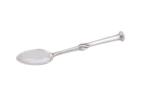 An Omar Ramsden silver spoon, the stem of tapered hexagonal form with a spiral knopped mid section and with a hexagonal terminal, London 1927, length