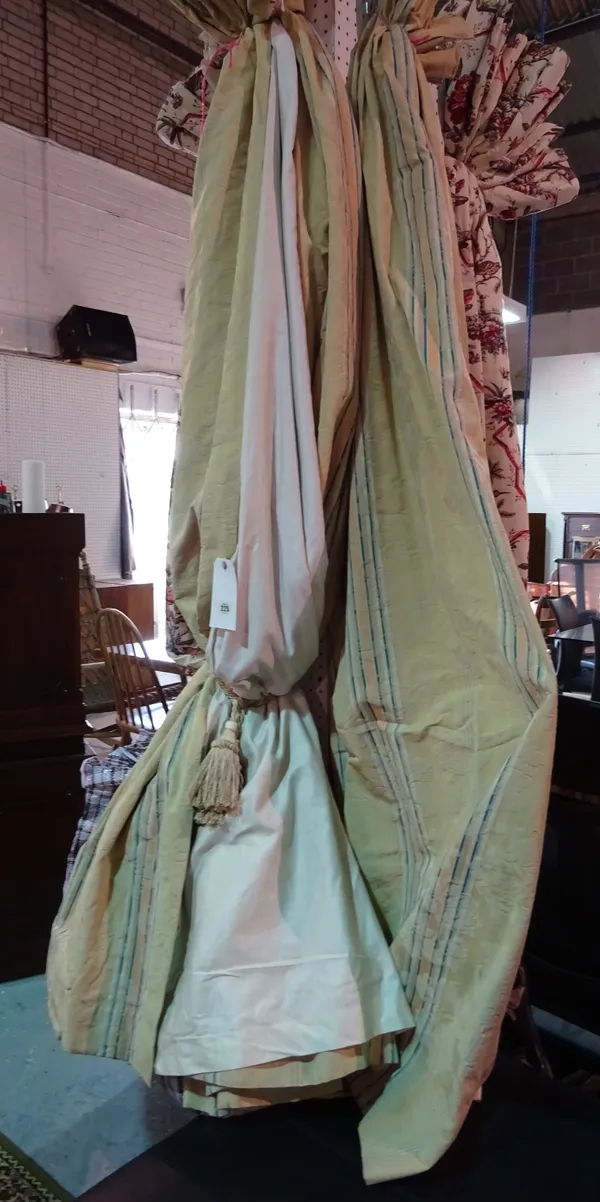 Curtains comprising; a pair of yellow ground and pale peach and blue striped curtains with swags and tails, 135cm wide 220cm drop, and another set, 77