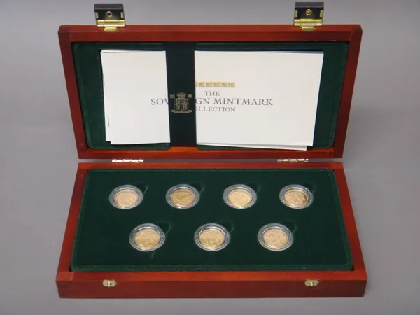 A set of seven George V sovereigns, with a certificate detailed, This Collection Comprises, seven sovereigns of George V, one struck by The Royal Mint