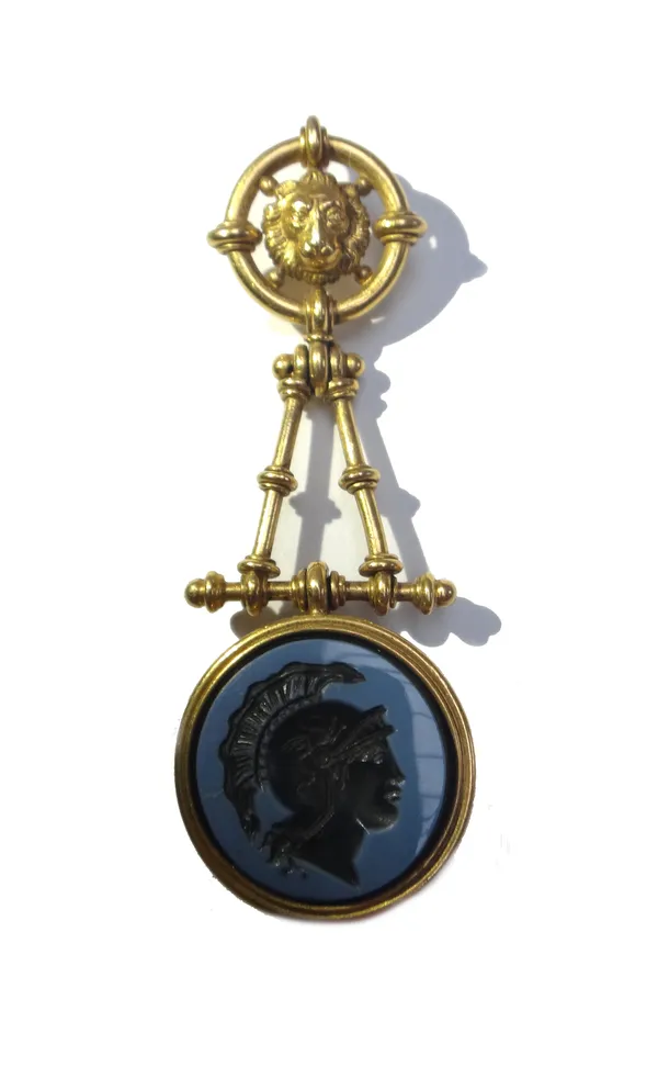 A circular intaglio pendant, designed as the head of a classical warrior with plumed helmet, suspended from an articulated framework below a circular