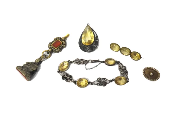 A Victorian cornelain mounted watch key, a cornelian mounted fob seal, an oval brooch, the centre formerly enamelled, with a surround of seed pearls a