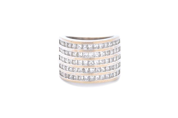 A white gold and diamond set half hoop ring, mounted with five rows of princess cut diamonds, detailed 750, ring size J, the total weight of the princ