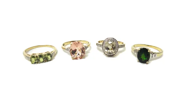 A gold, diamond and pale green gem set oval cluster ring and three 9ct gold, diamond and gem set rings, in a variety of designs, (4).