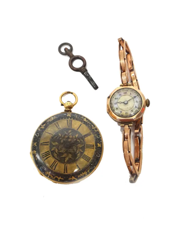 A ladies gold cased key wind openfaced fob watch, with a gilt cylinder movement, base metal inner case, the foliate engraved dial with black Roman num