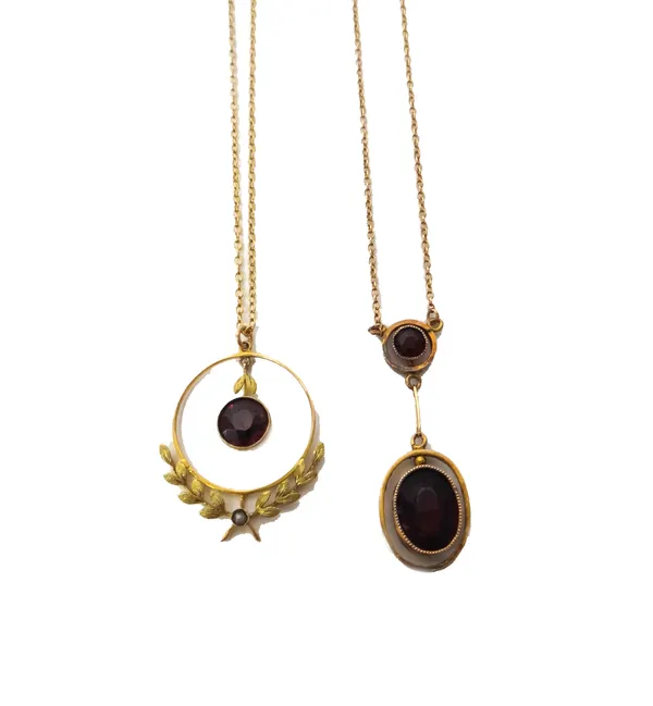 A gold, garnet and seed pearl set pendant necklace, with a foliate wreath motif, detailed 9 CT, with a gold neckchain on a boltring clasp and a gold a