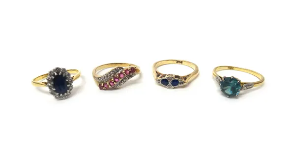 A gold ring, claw set with a circular cut blue zircon, detailed '18ct', a gold, sapphire and diamond set six stone ring, detailed '9ct', a 9ct gold, r