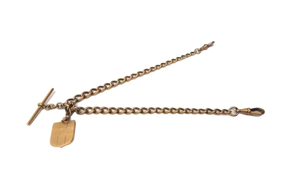 A 15ct gold graduated curb link watch Albert chain, fitted with a 15ct gold T bar, two gold swivels and with a shield shaped fob medallion, detailed 1