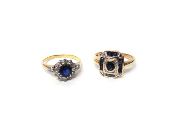 A gold, sapphire and diamond set cluster ring, claw set with the cushion shaped sapphire at the centre, in a surround of circular cut diamonds, betwee