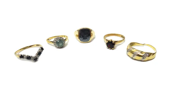 An 18ct gold, diamond and blue zircon set cluster ring, a 9ct gold and garnet set single stone ring, a 9ct gold and haematite intaglio ring, a 9ct gol