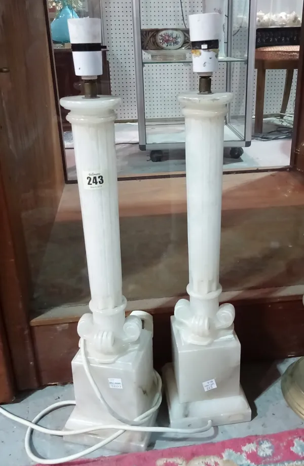A pair of 20th century white onyx lamps, of carved column form, 57cm high overall, (2). D3