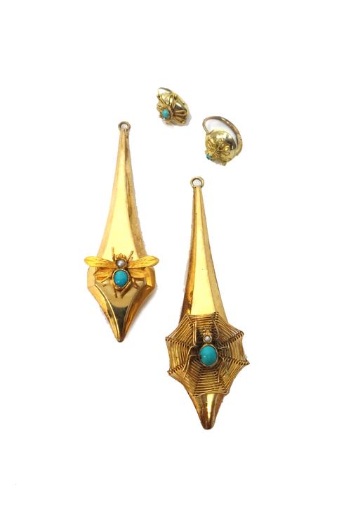 A pair of turquoise and seed pearl set drop shaped earrings, one with a spider and web motif, the other with a winged insect motif, with detachable to