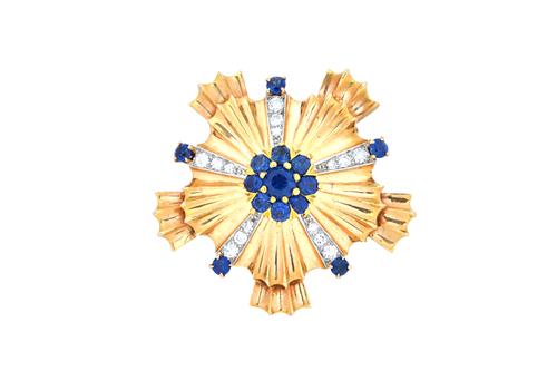 A gold, sapphire and diamond brooch, in a cinquefoil design, having a sapphire nine stone cluster to the centre, with five diamond set radiating point