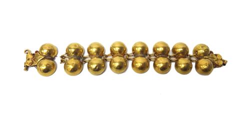 A modern gold bracelet in a reproduction style of a Roman design, formed as a series of pairs of hemispherical links, connected by beaded wirework and