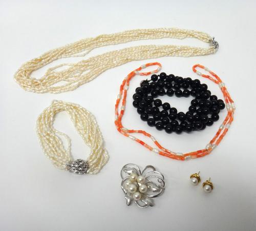 A pair of gold and cultured pearl earstuds, detailed to the backs K 18, with post and butterfly clip fittings, a silver and cultured pearl brooch, des