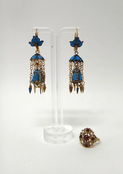 A 9ct gold, garnet and half pearl set oval cluster ring, having pierced decoration, London 1959, ring size N and a half and a pair of Asian blue feath
