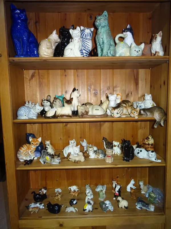 A group of 20th century and later ceramic cats of various shapes and sizes, (qty). I3