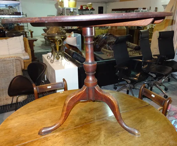 A George III mahogany tilt top occasional table, on three downswept supports, 100cm wide x 76cm high.  E5