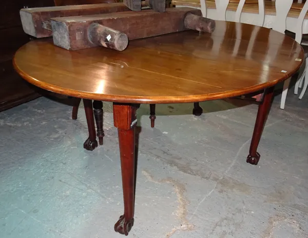 A George III mahogany drop flap table on ball and claw feet, 115cm wide x 71cm high. G7