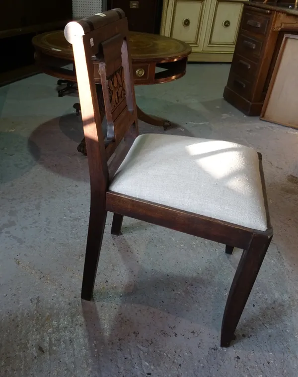 A set of six mid-20th century stained oak dining chairs, with floral carved backs, (6).  D7