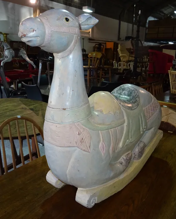 An early 20th century rocking camel, 86cm wide x 73cm high.  C7