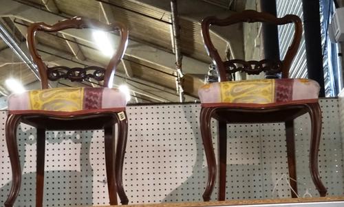 A pair of Victorian mahogany balloon back hall chairs, on cabriole supports, (2). S4T