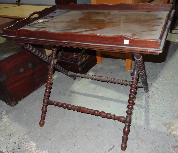 A Victorian oak tray on stand, on bobbin turned supports, 50cm wide x 72cm high.  E2