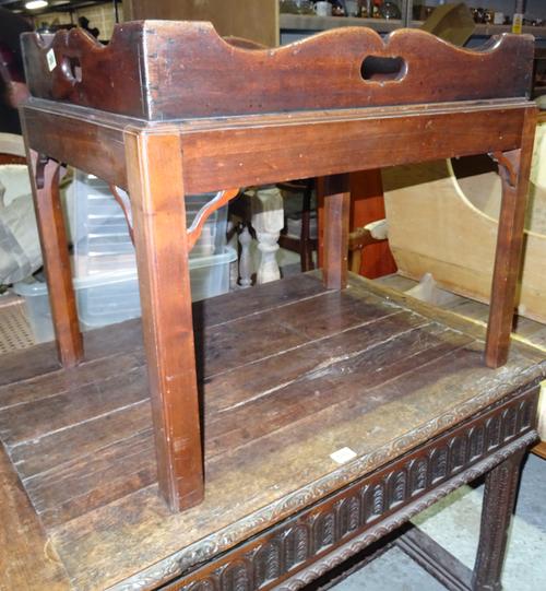 A George III mahogany tray on stand, with galleried top, 63cm wide x 54cm high, together with an oval mahogany side table, 73cm wide x 46cm high, (2).