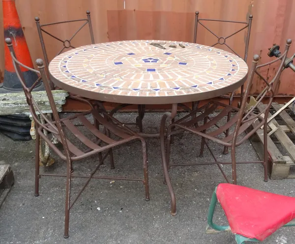 A 20th century circular reconstituted stone garden table, with mosaic decoration, on four metal outswept supports, together with four metal chairs, 12
