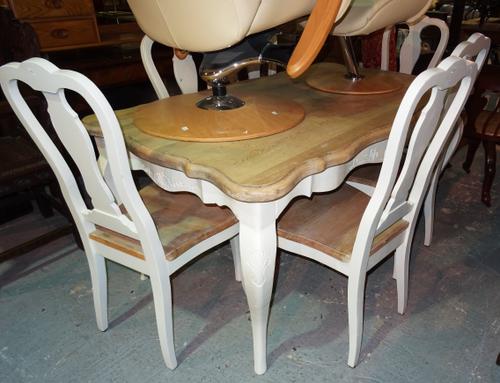 A 20th century white painted pine dining table, 157cm wide x 81cm high, together with a matching set of six white painted vase back dining chairs, (7)