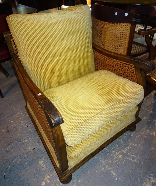 An early 20th century bergere low armchair, on turned supports.  H7