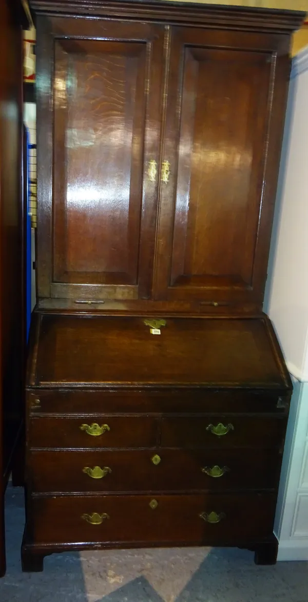A George I and later oak bureau bookcase, on bracket feet, 100cm wide x 208cm high.  M9