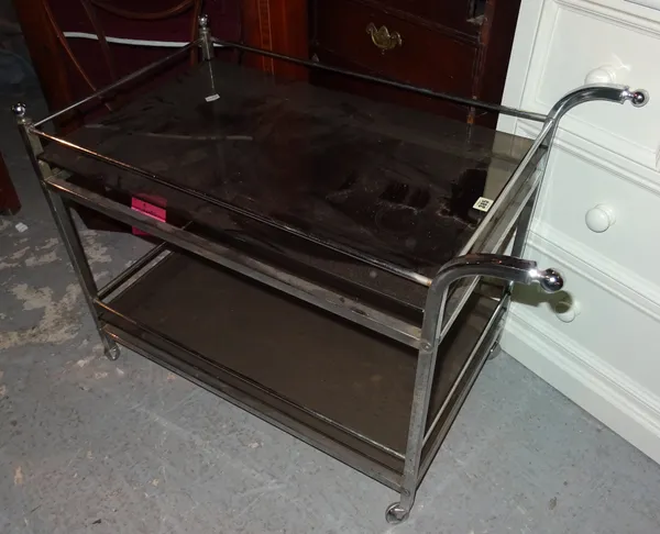 A 20th century chrome and glass two tier serving trolley, 86cm wide x 67cm high.  K8