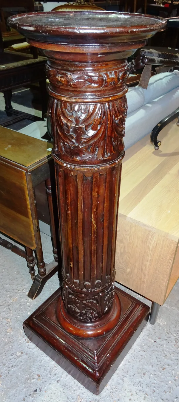 A pair of 20th century Regency style mahogany jardiniere stands, with fluted column and acanthus decoration, on plinth base, 32cm wide x 115cm high.