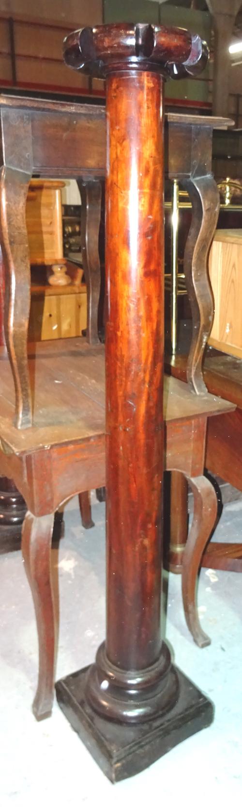 A pair of  Regency style mahogany jardiniere stands, with turned column and circular top, 27cm wide x 154cm high.  I9