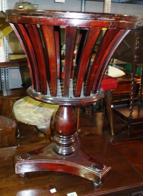 A George III style mahogany jardiniere stand, with lift top and slatted sides, on bun feet, 48cm wide x 66cm high.  J3