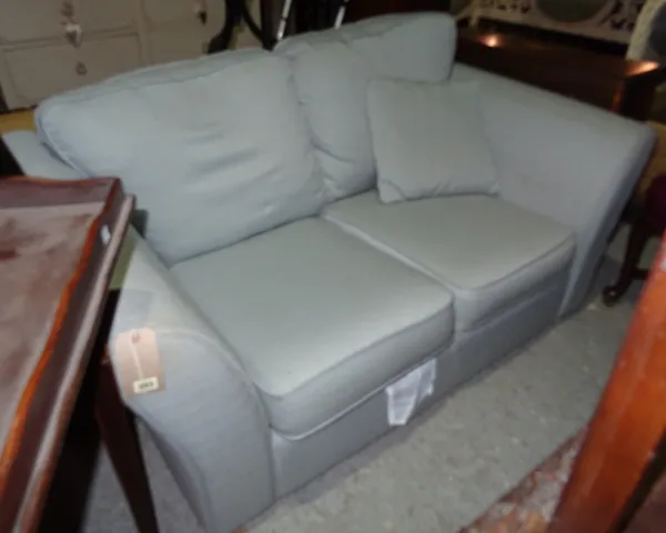 A 20th century grey upholstered two seat sofa, with outswept arms.  J4