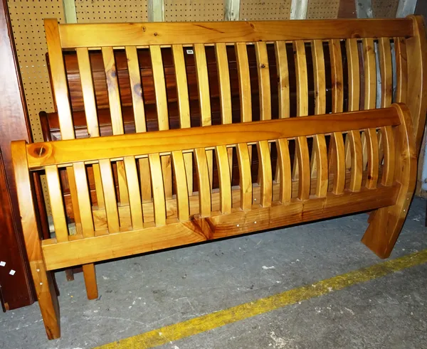 A 20th century pine sleigh double bed.  EXTRA