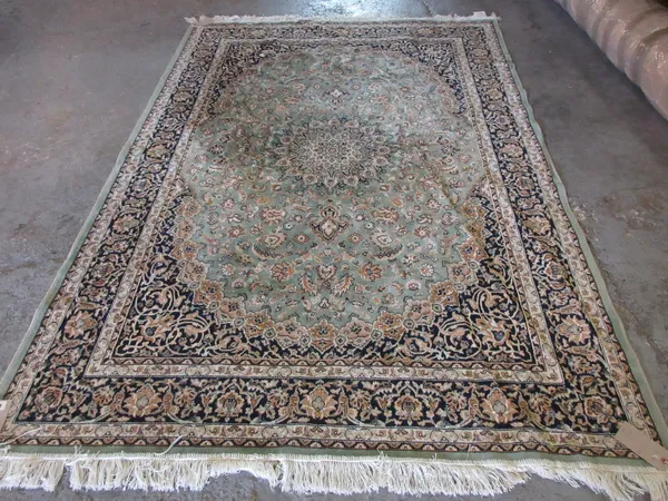 A 20th century machine made rug.