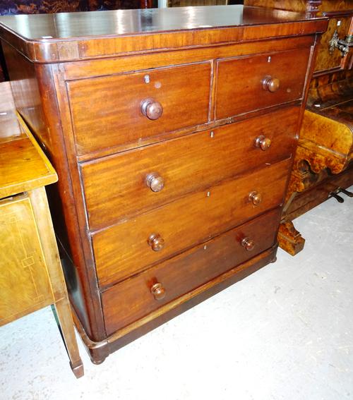An early 19th century straight fronted mahogany chest of two short and three long drawers, on bun feet, 100cm wide x 117cm high.  A8