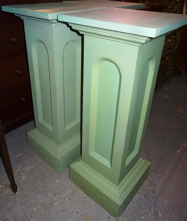 A pair of 20th century green painted jardiniere stands, each on plinth base, 40cm wide x 100cm high, (2).  M7