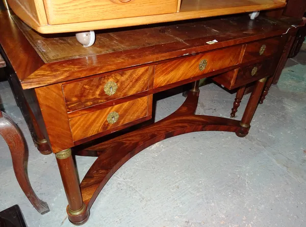 An Empire style ormolu mounted writing desk, on bun feet united by undertier, 130cm wide x 76cm high.I9