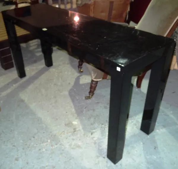 A 20th century ebonised rectangular console table, on square tapering supports, 153cm wide x 76cm high.  L4