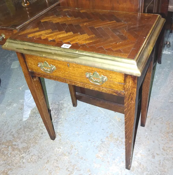 A 20th century oak side table, with parquetry top and brass edges, on square tapering supports, 57cm wide x 72cm high.  J3