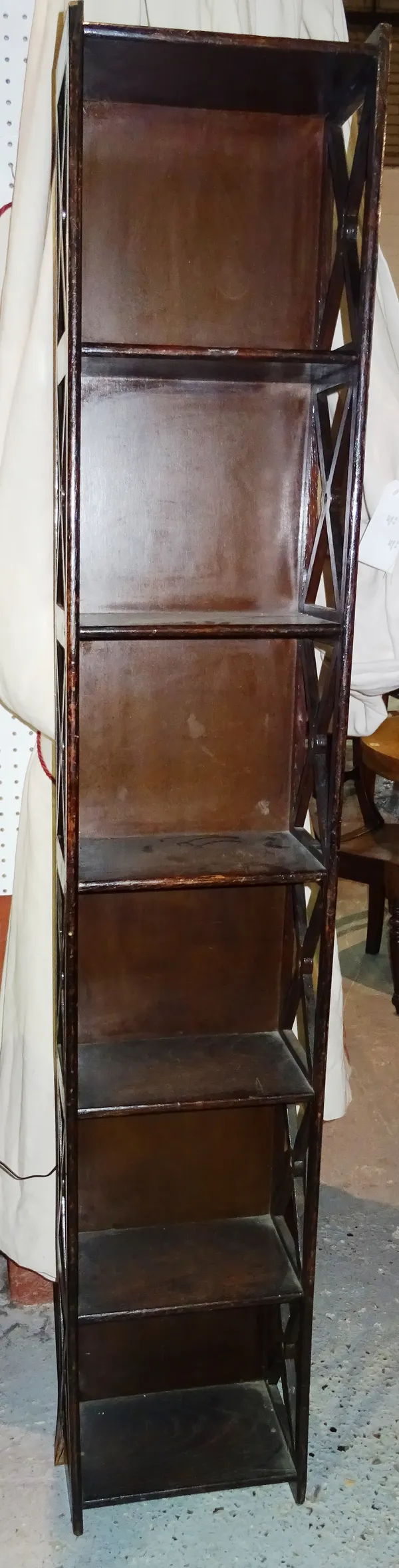 A 20th century mahogany seven tier open bookshelf, with fret cut sides, 33cm wide x 183cm high.  H5