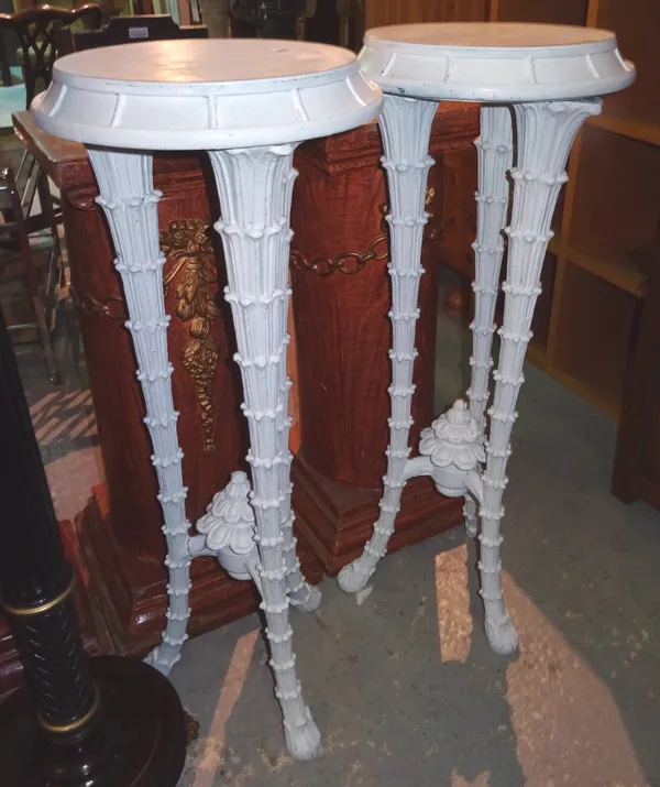 A pair of 20th century white painted jardiniere stands, each with circular top on three naturalistic tapering supports, 40cm wide x 106cm high, (2).