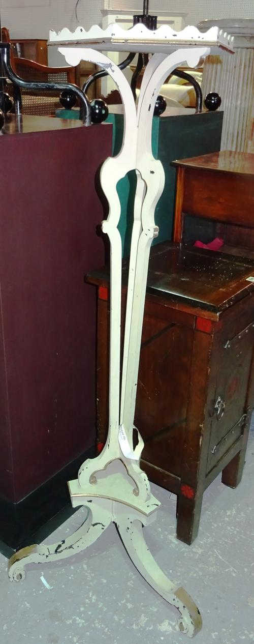 A pair of cream painted Continental style torchere stands, each with hexagonal top and three central columns, on scroll supports, 35cm wide x 145cm hi