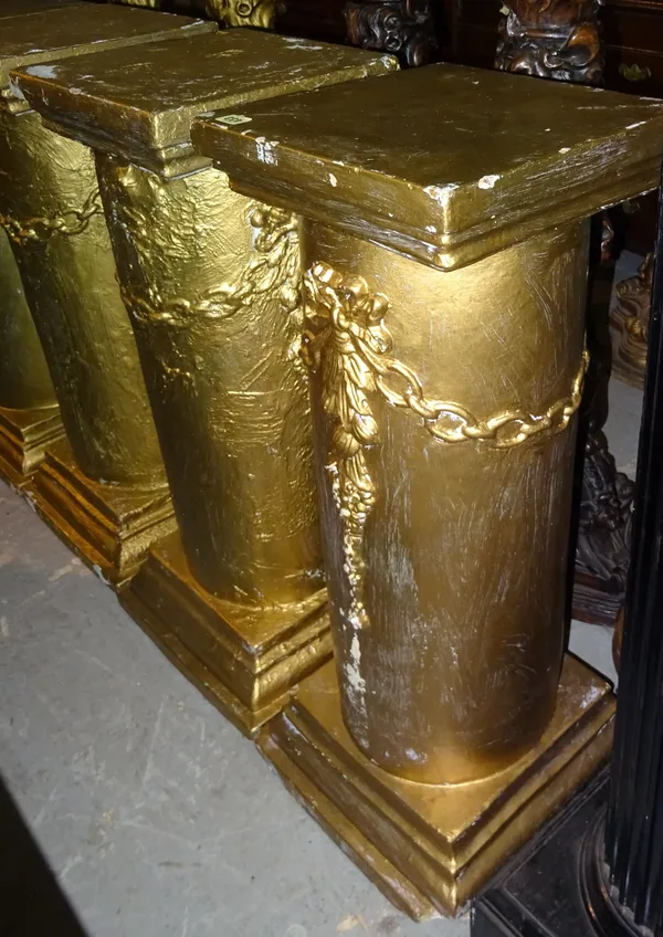 A pair of 20th century gold painted jardiniere stands, with ribbon and chain moulding, 36cm wide x 91cm high, (2).  M7