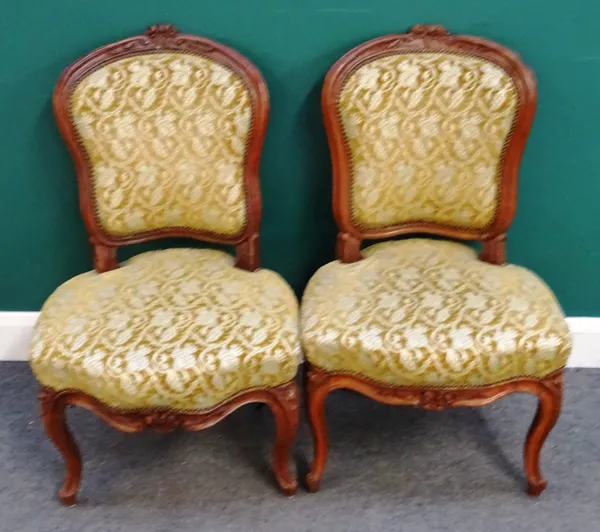 A near pair of Louis XV style carved beech side chairs with serpentine seat on scroll supports, 55cm wide x 88cm high.  H4