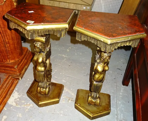 A pair of 20th century giltwood console tables, with nude female figural supports, 34cm wide x 72cm high, (2).  M10