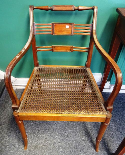 A pair of Regency style mahogany framed open armchairs on splayed turned supports, 60cm wide x 84cm high.   I5